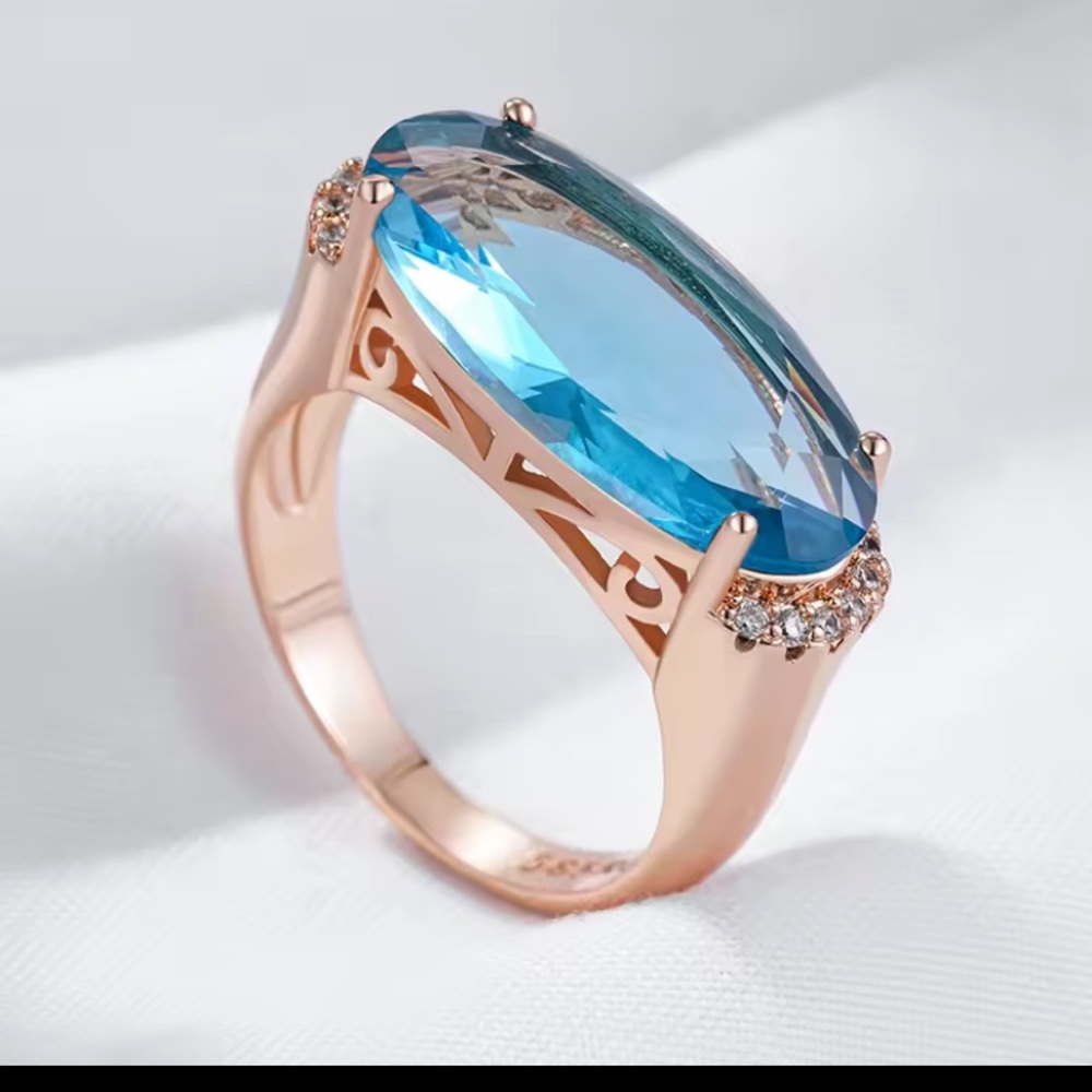 Rose Gold Ring with Aquamarine Blue Oval Gemstone